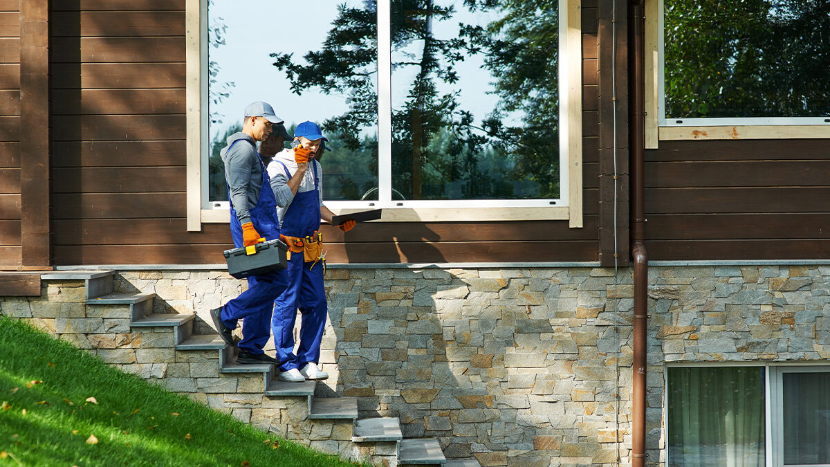 Homeowners Inspecting Home For Siding Damage In Wichita Ks