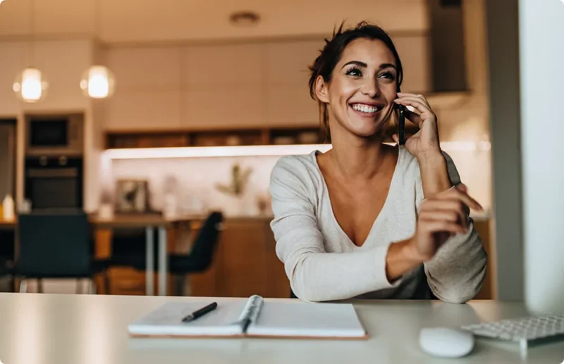 Customer On Phone With Home Insurance Adjuster Customer On Phone With Home Insurance Adjuster