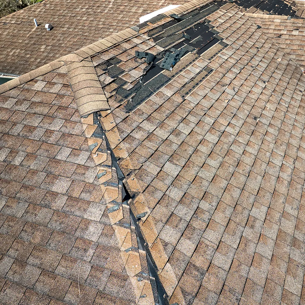 Severely Damaged Roof After A Storm